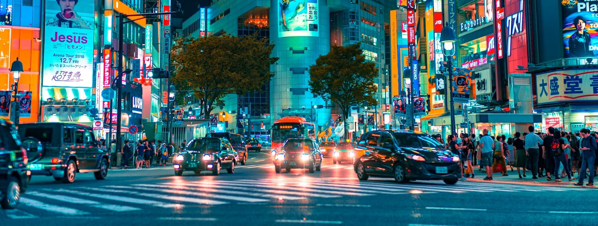 people gathered outside buildings and vehicles