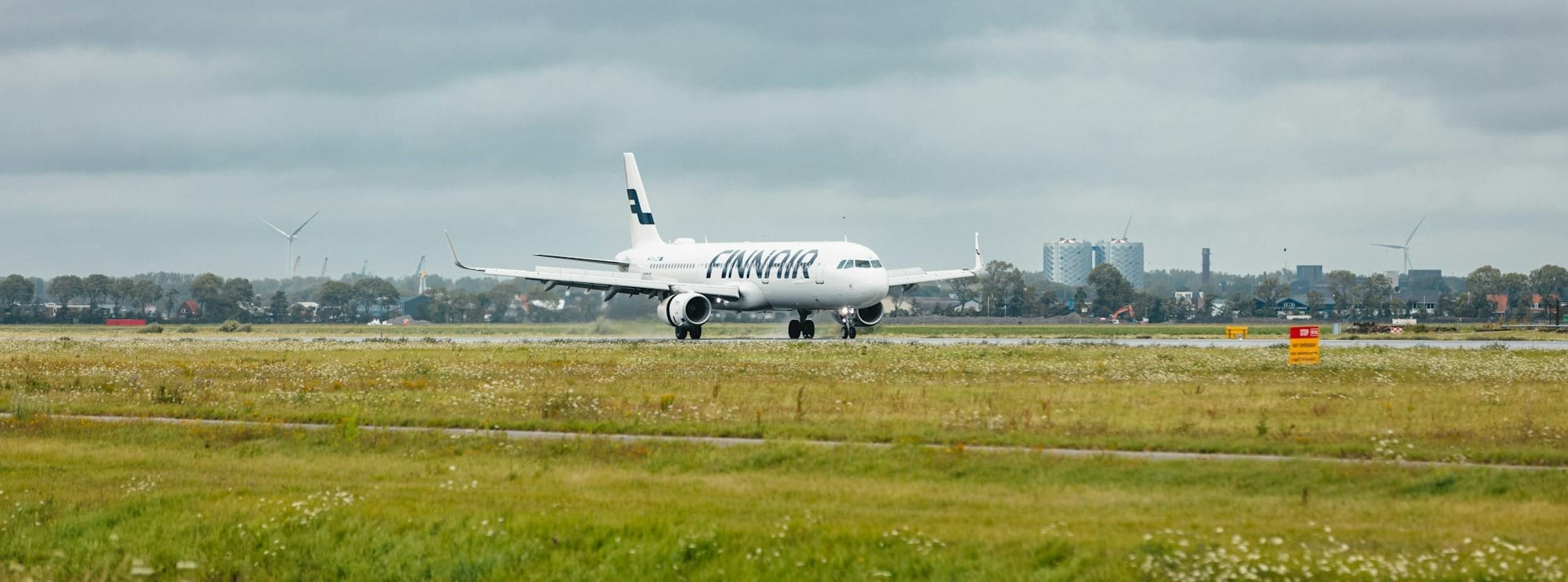 a large jetliner sitting on top of an airport runway