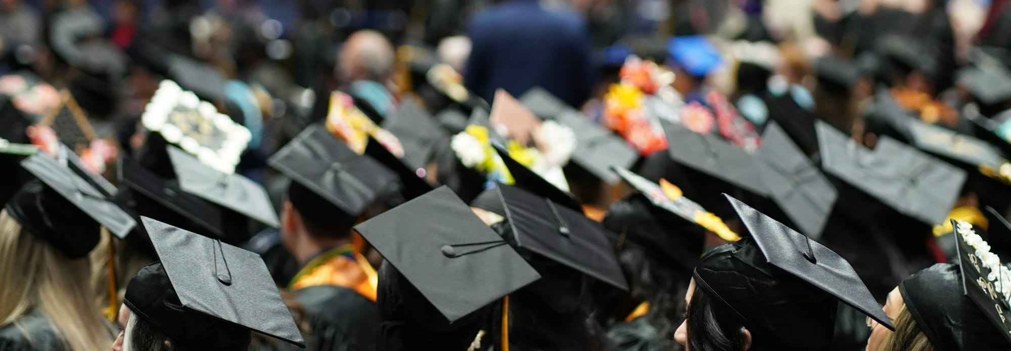 A large group of people in graduation caps and gowns