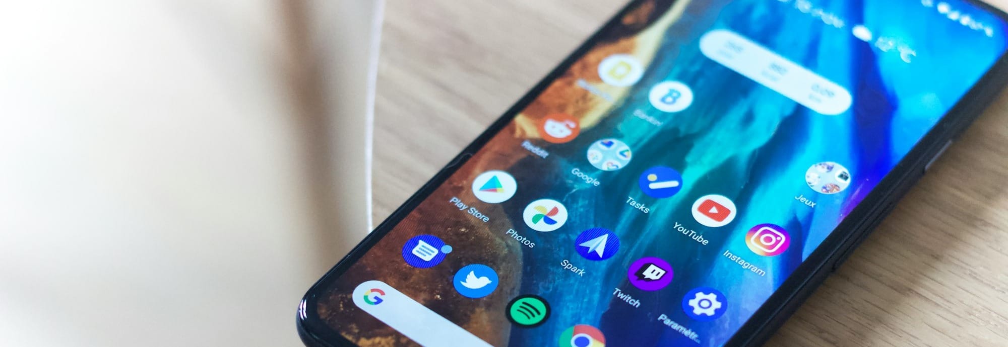 black android smartphone on brown wooden table