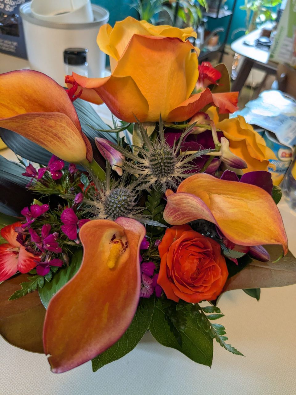 Orange and purple flowers in a vase
