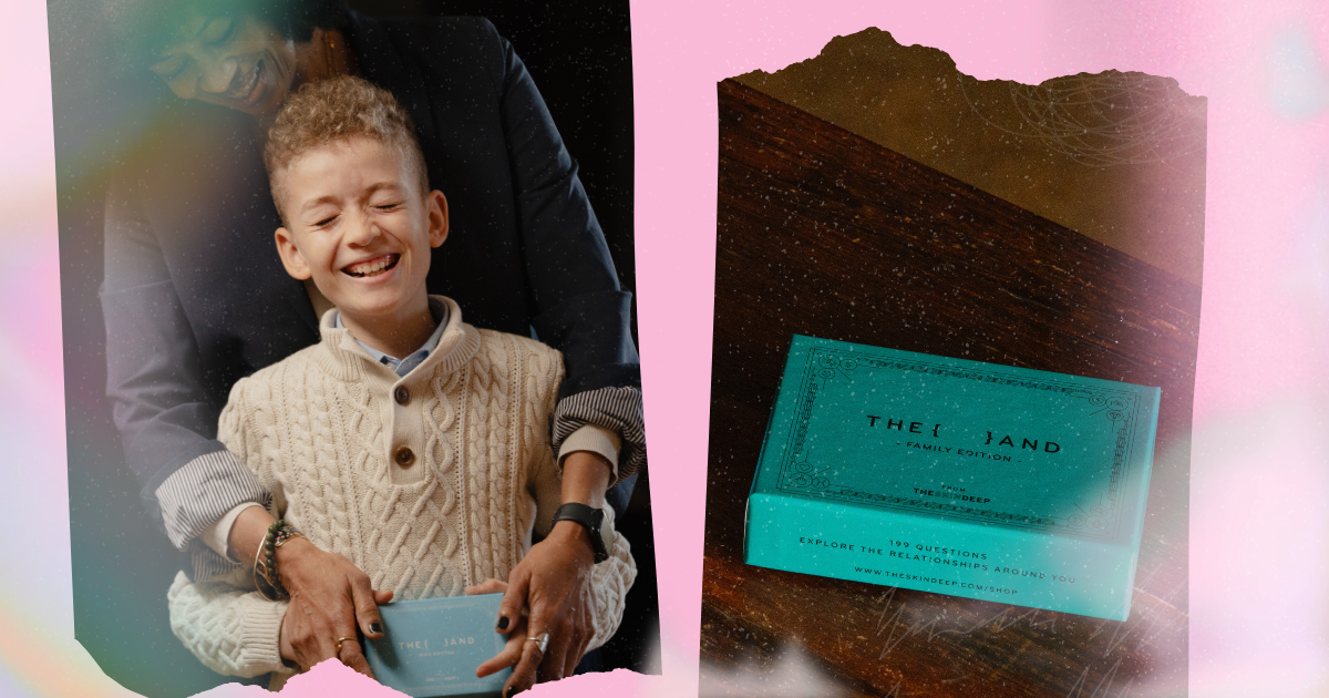 A child laughing while being embraced by an adult next to the {THE AND} Kids Edition card game box, alongside the {THE AND} Family Edition card game