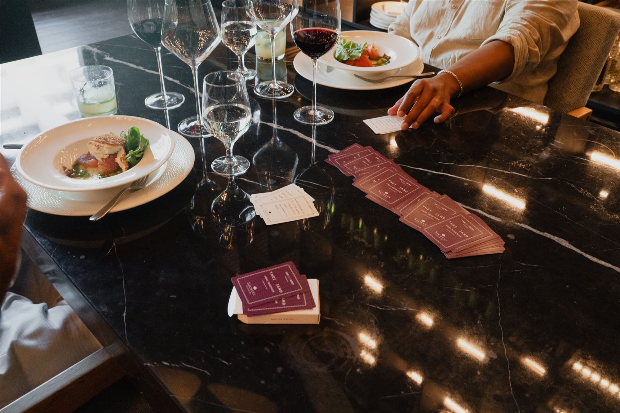 {THE AND} Cards spread across a table