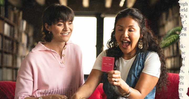 Picture of a lesbian couple sitting holding hands and playing a relationship card game laughing, Alyson Stoner