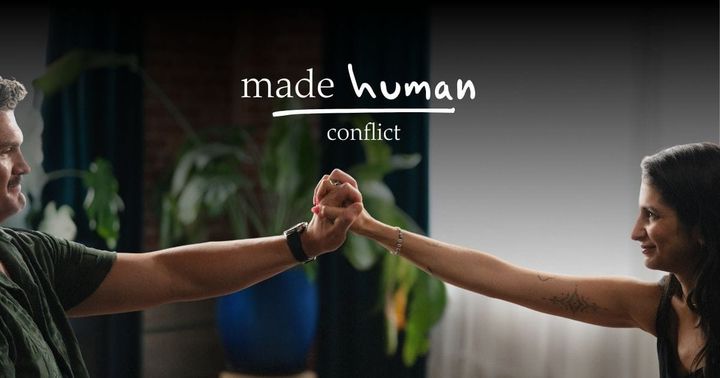 Two people holding hands