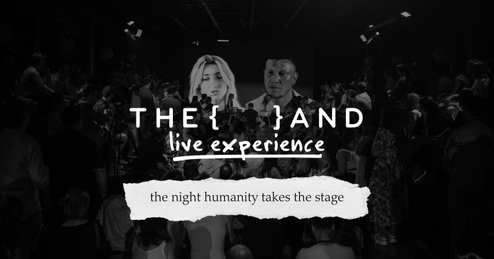 Picture of a stage full of people and two faces on the screen