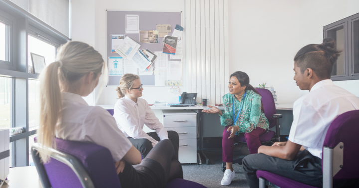 A manager and her 3 employees have a candid converation