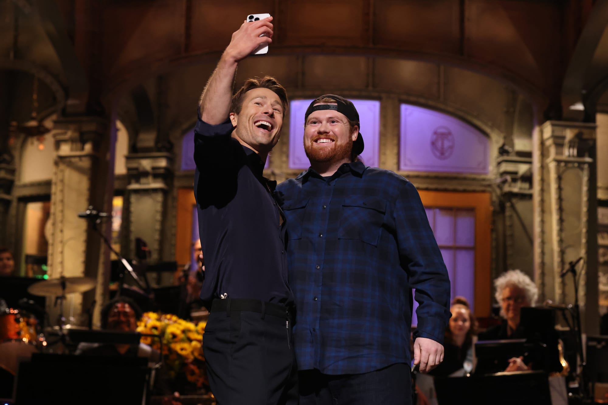 Glen Powell and Mitch the UPS Driver.