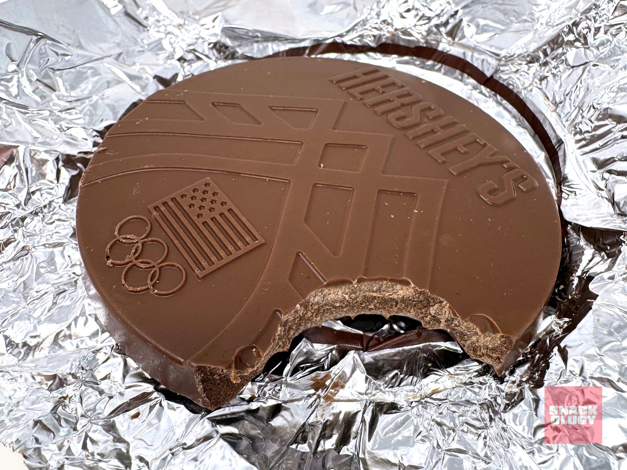 Hershey’s Team USA Chocolate Medal with a bite taken out of it