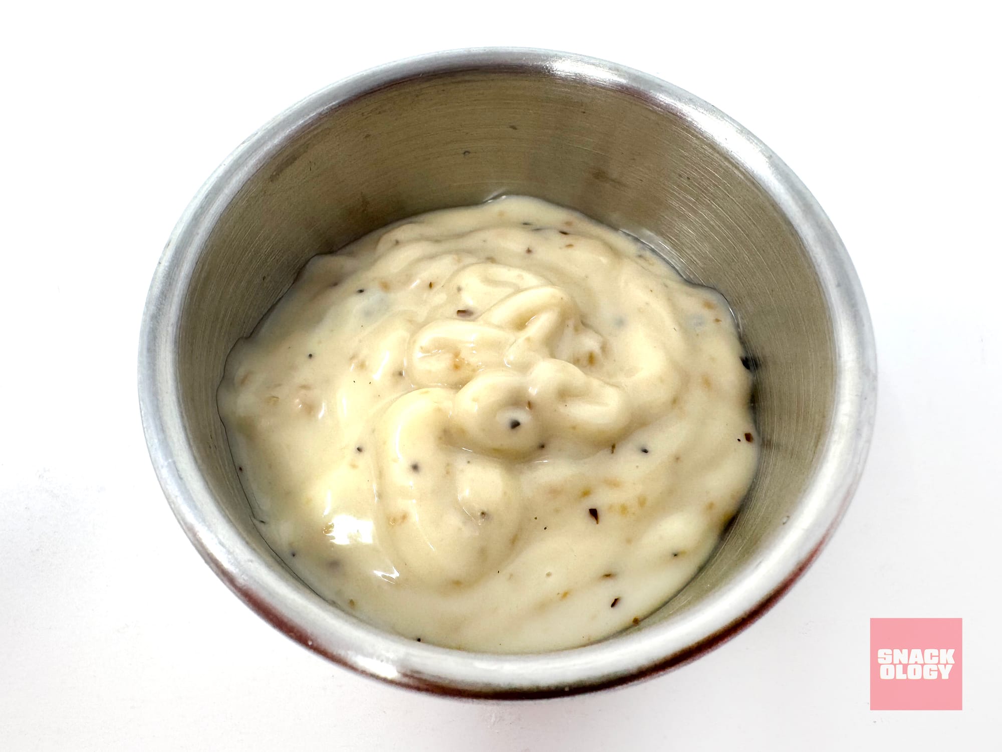 A dipping cup of Heinz Lemon Pepper Parm Mayonnaise-Style Dip