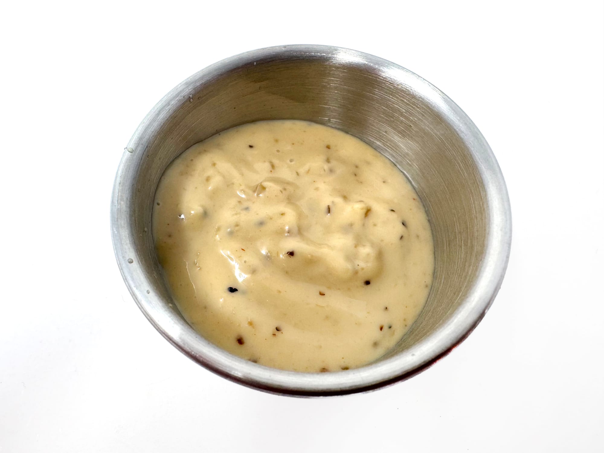 A dipping cup of Heinz Steakhouse Garlic Mayonnaise-Style Dip
