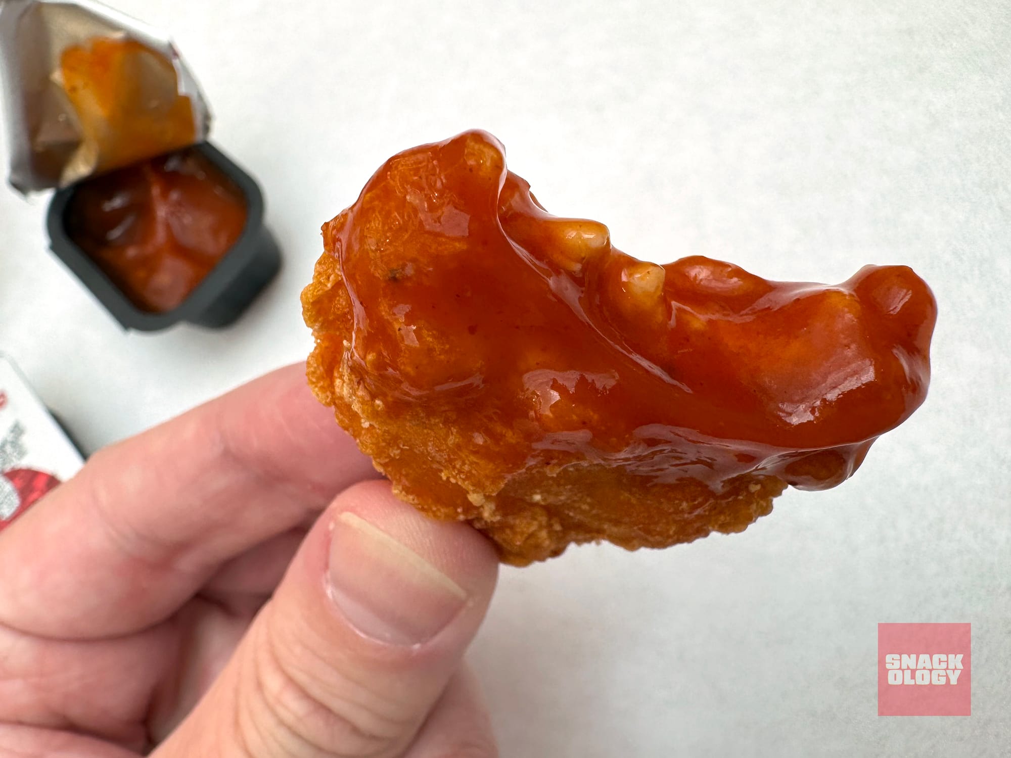 A Spicy Chicken McNugget and Mighty Hot Sauce