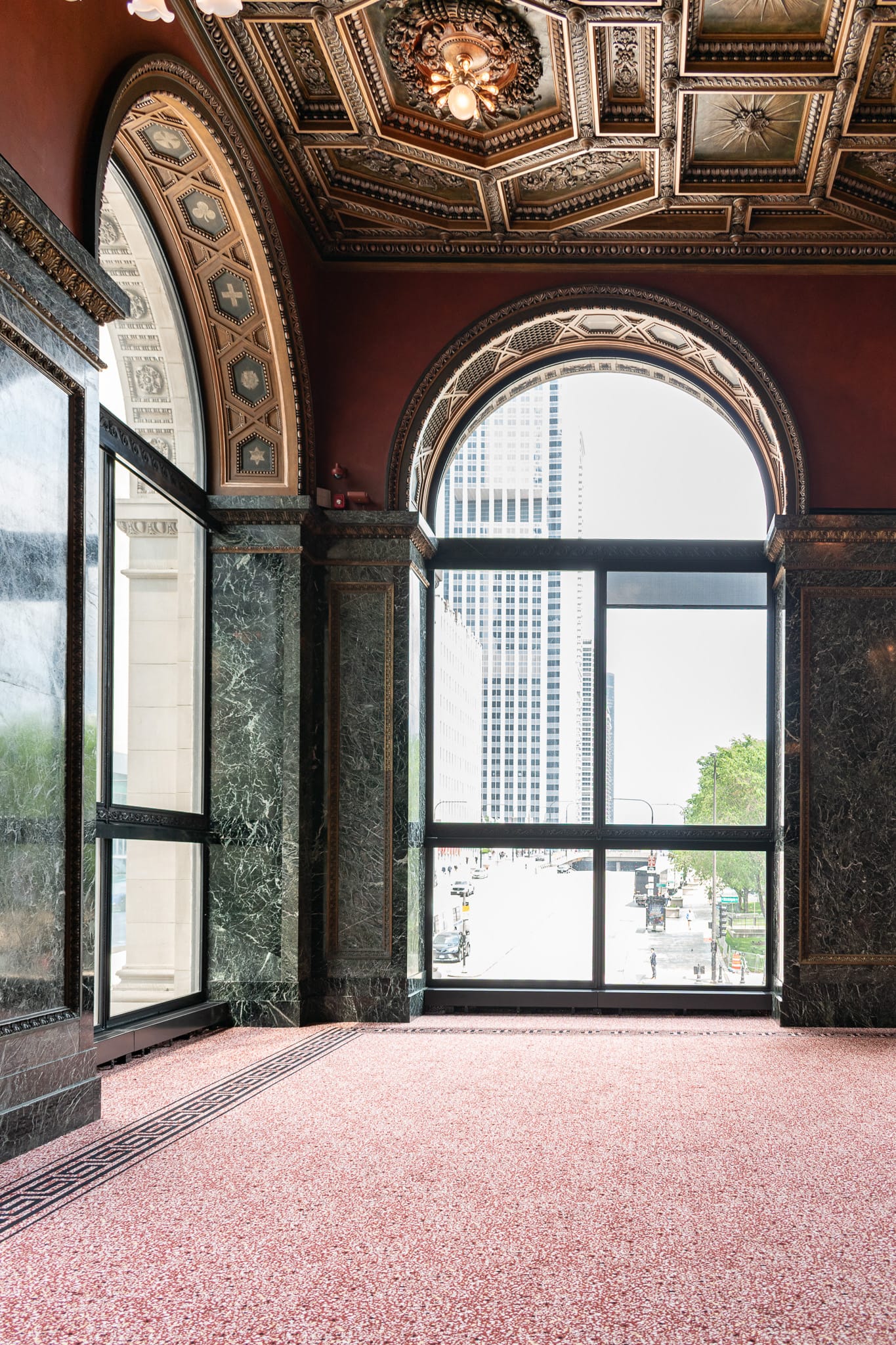 Northeast corner of the G.A.R. Memorial Hall looking out towards Randolph, red carpet, green ver antique walls