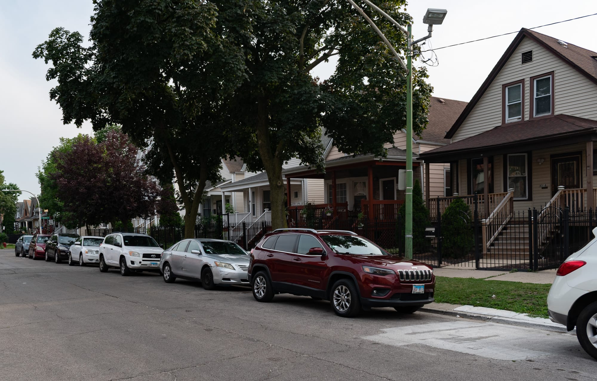 two story wooden houses in a row on a Chicago street