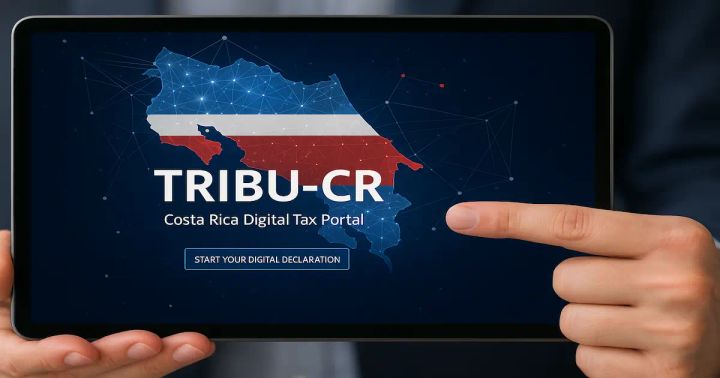 Finger pointing at “TRIBU-CR” on a tablet with a digital Costa Rica map—launch of Costa Rica’s tax portal.