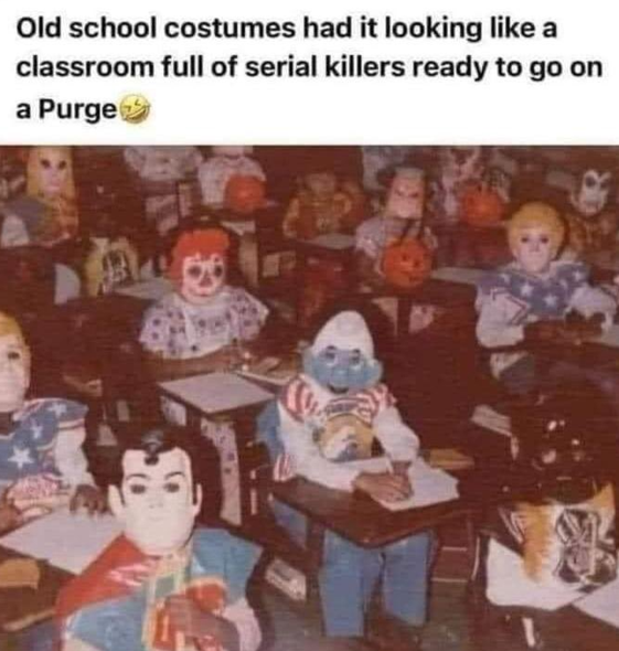 PIcture of children in a classroom wearing old costumes from the 70s/80s that included a plastic mask and a plastic apron costume. Costumes pictured include Superman, smurf, Raggedy Ann, etc.