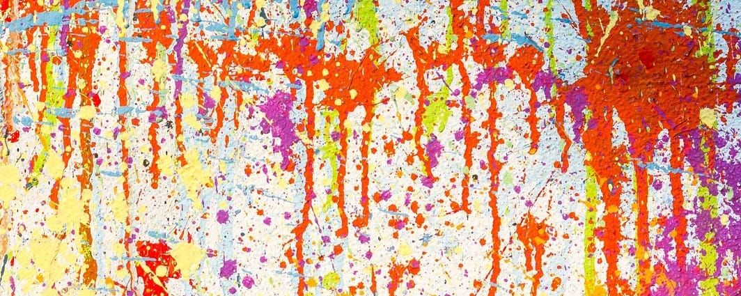 Red paint splattered against a wall