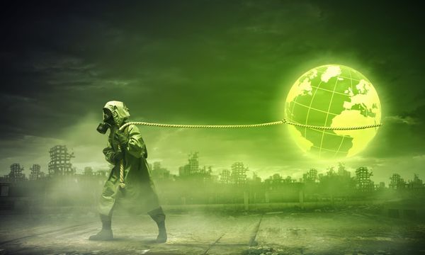 Person in Hazmat suit tows the planet earth on a rope while surrounded by a neon green glow