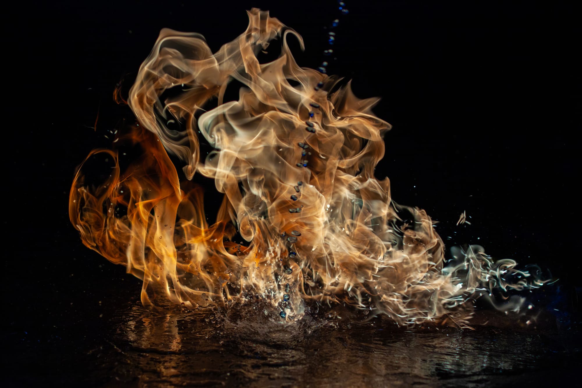 Droplets of Methylated Spirits slash onto water before catching on fire. f/2.8. 1/8000 sec. ISO 250 . 50mm.