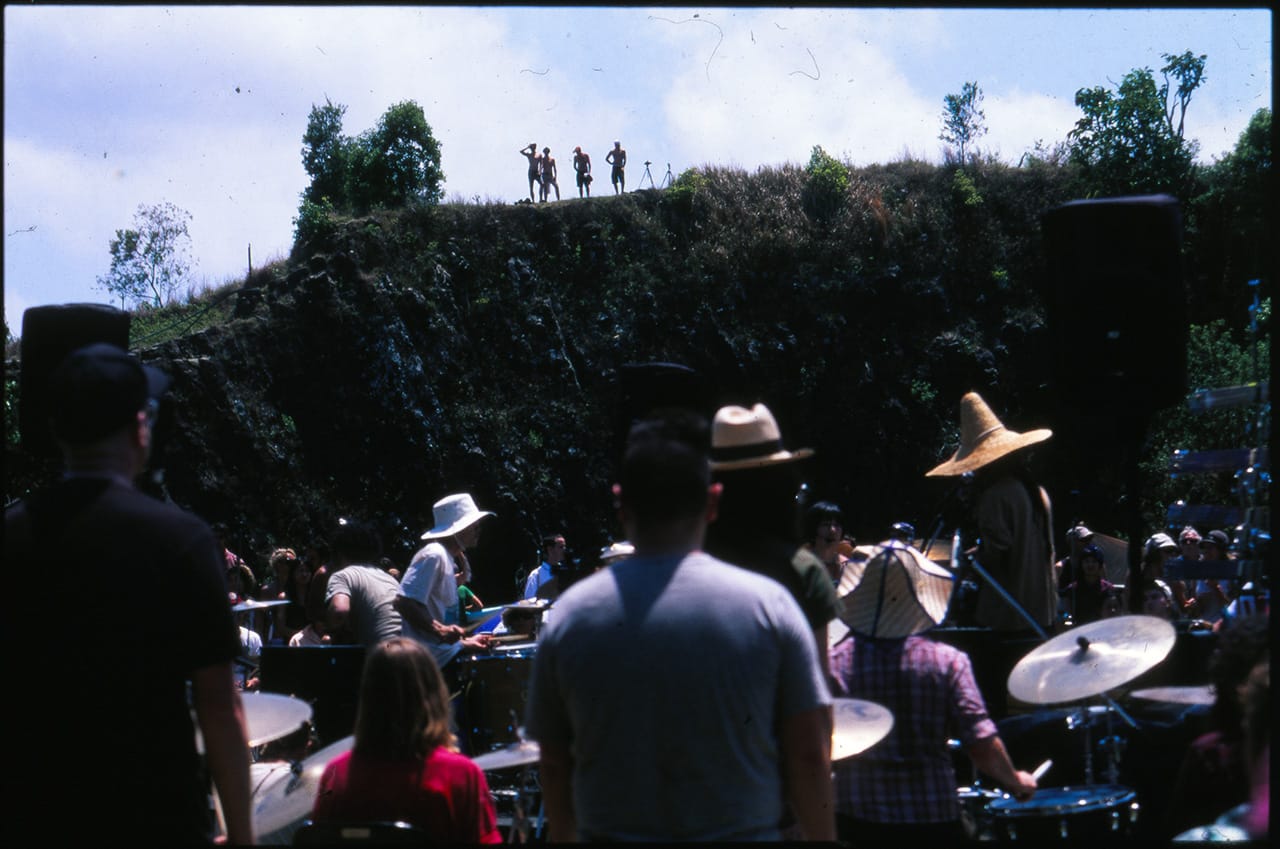 A crowd watches from the cliff tops at the Island Quarry - Boredoms - Boadrum111 - Byron Bay November 2011