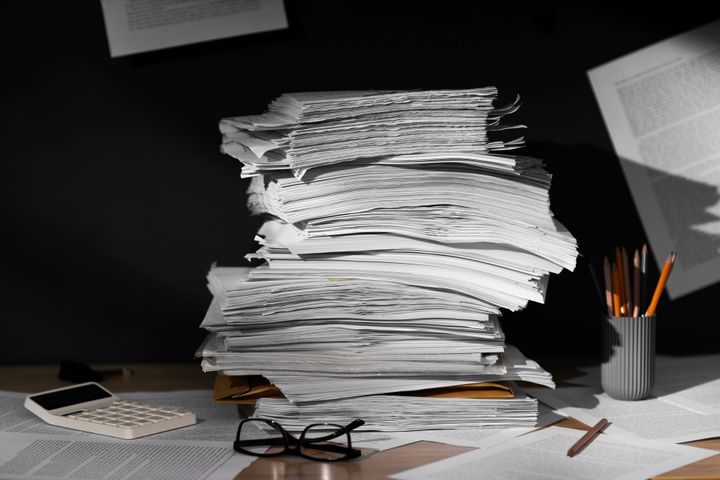 Paper stacked on desk 