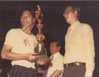 Dr. Colin Koh receiving the 1981 Singapore National Tai Chi Tui Shou Champion Trophy from Mr Goh Chok Tong Dr. Colin Koh receiving the 1981 Singapore National Tai Chi Tui Shou Champion Trophy from Mr Goh Chok Tong