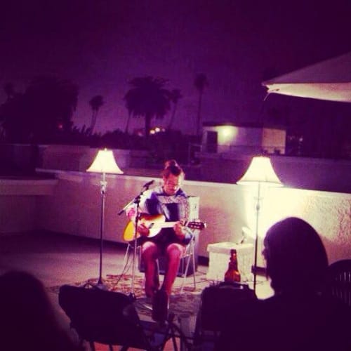  Joseph Voelbel performing comedy on a Venice Rooftop. 