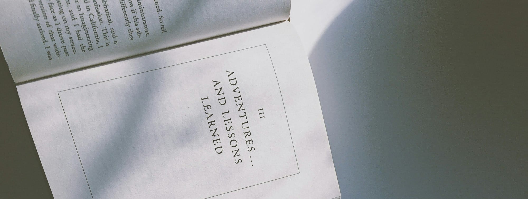 III Adventures and lessons learned text on open book page