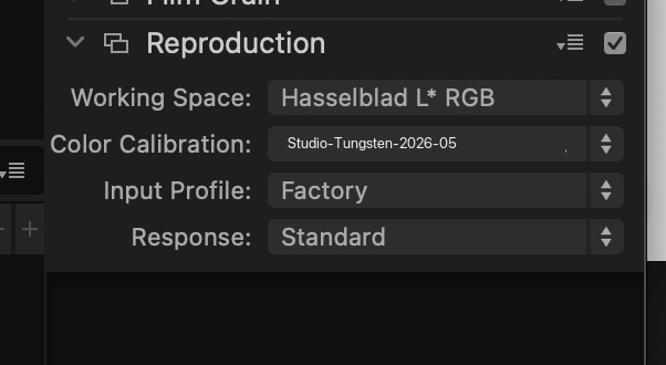 The Reproduction tool panel in the Adjust tab, showing the four controls: Working Space, Color Calibration, Input Profile, and Response. The dropdown values shown reflect a configured reproduction setup. The defaults for general scene photography are Hasselblad RGB, no Color Calibration, Factory, and Standard.