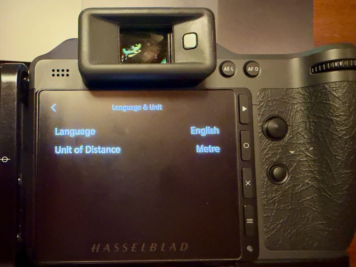 The Language and Unit menu on the rear screen of a Hasselblad X2D II, with Unit of Distance set to Metre