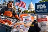 American fisherman with fresh seafood, U.S.-caught seafood labels and FDA inspection of imported seafood under the America First Seafood Strategy.