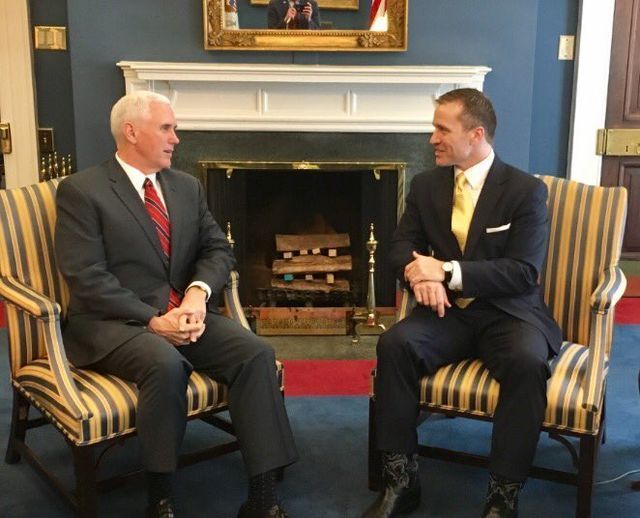 Mike Pence and Eric Greitens seated at the White House