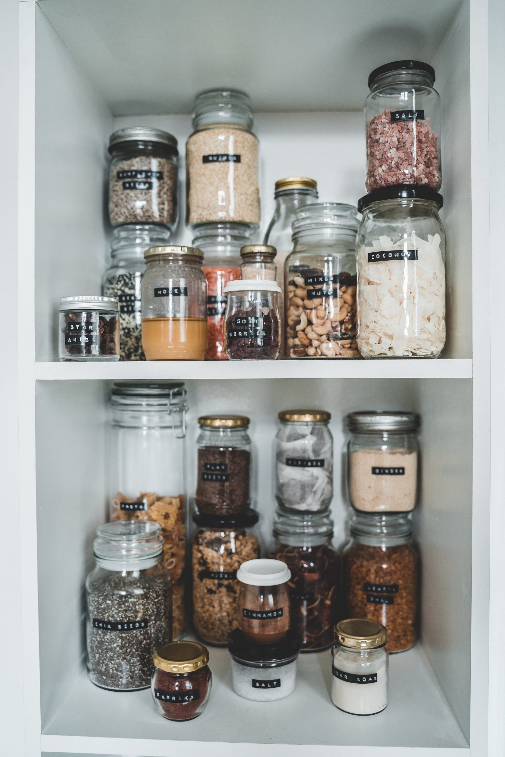 Recycled glass jars, used to store seeds, flour and other foods