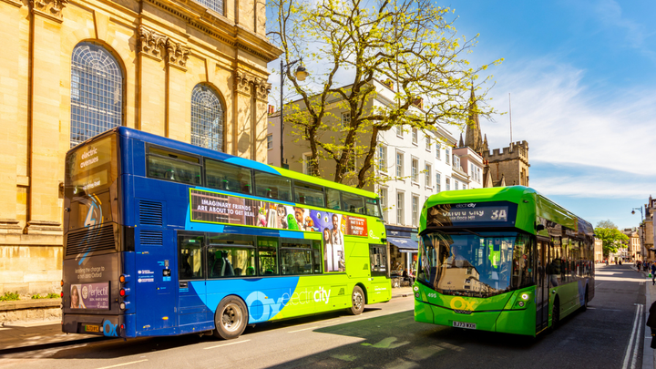 Buses travelling down High Street in Oxford