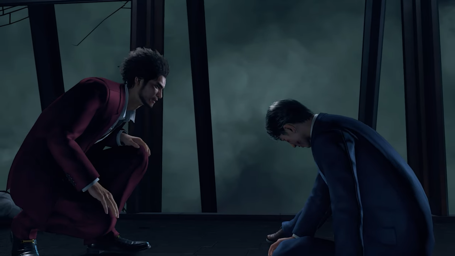 "A Yakuza: Like a Dragon screenshot of Ichiban Kasuga kneeling down towards Masato Arakawa, who is sitting, bruised, on the floor."