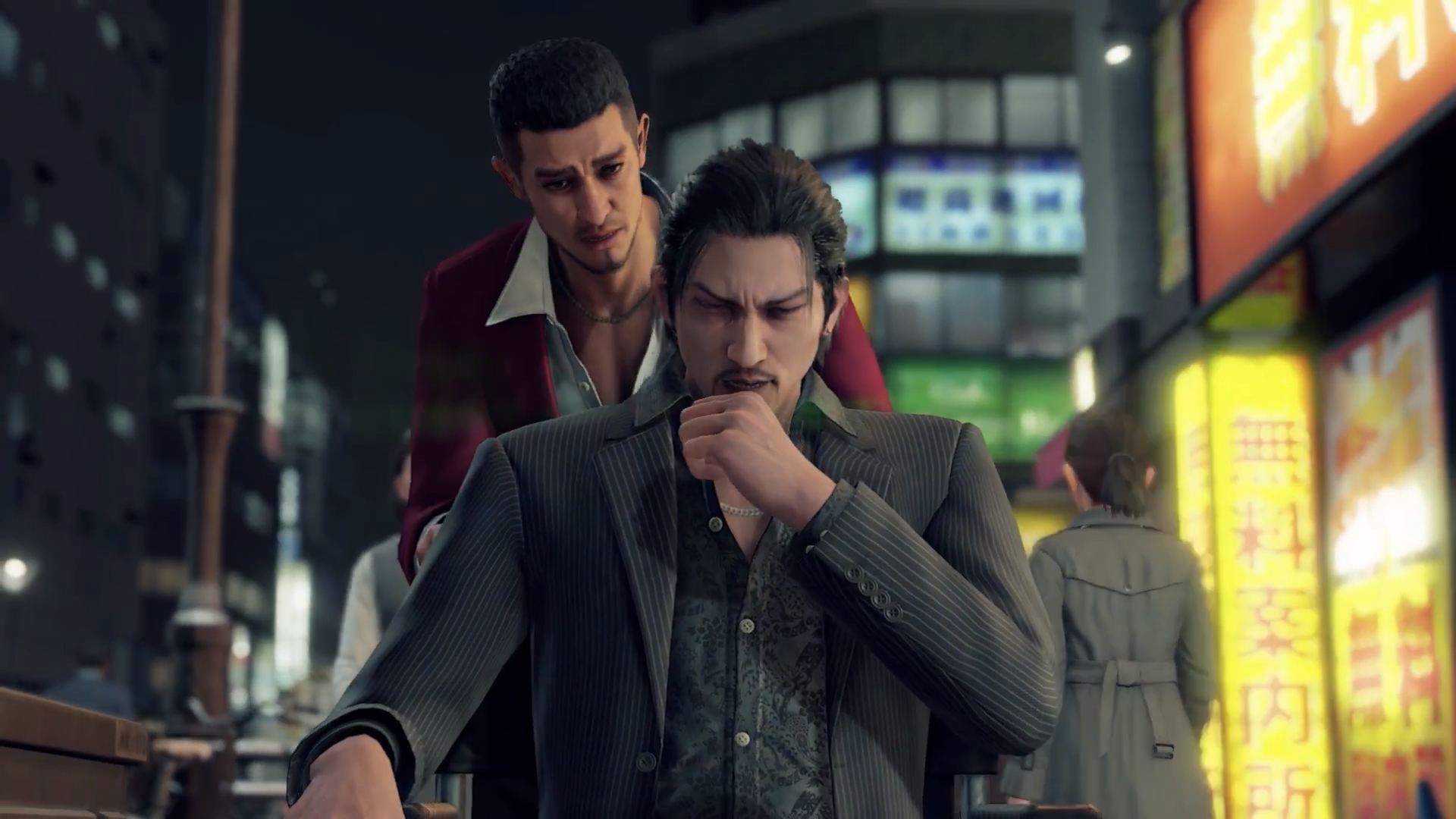 "A Yakuza: Like a Dragon screenshot of Ichiban Kasuga pushing Masato Arakawa in a wheelchair while Masato coughs