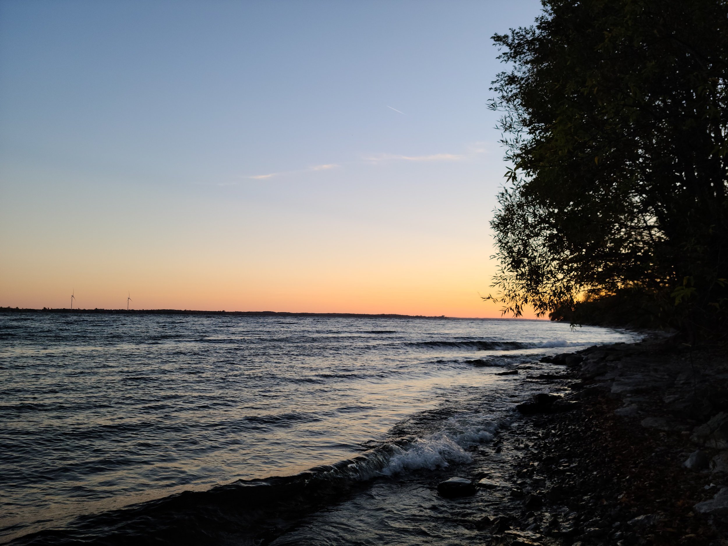 Small wave breaking in Lake Ontario during a sunset