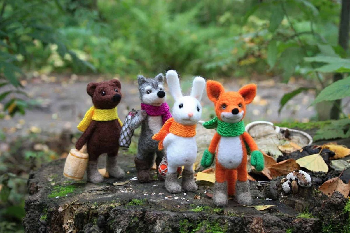 The toys-animals felted of wool as the characters of autumn fairy-tale