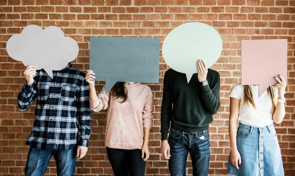 Friends holding up copyspace placard thought bubbles
