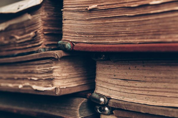 stack of books for paper research