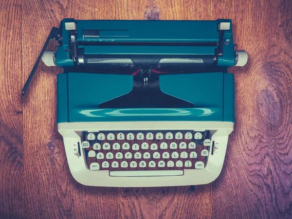 Vintage Typewriter On Wooden Background