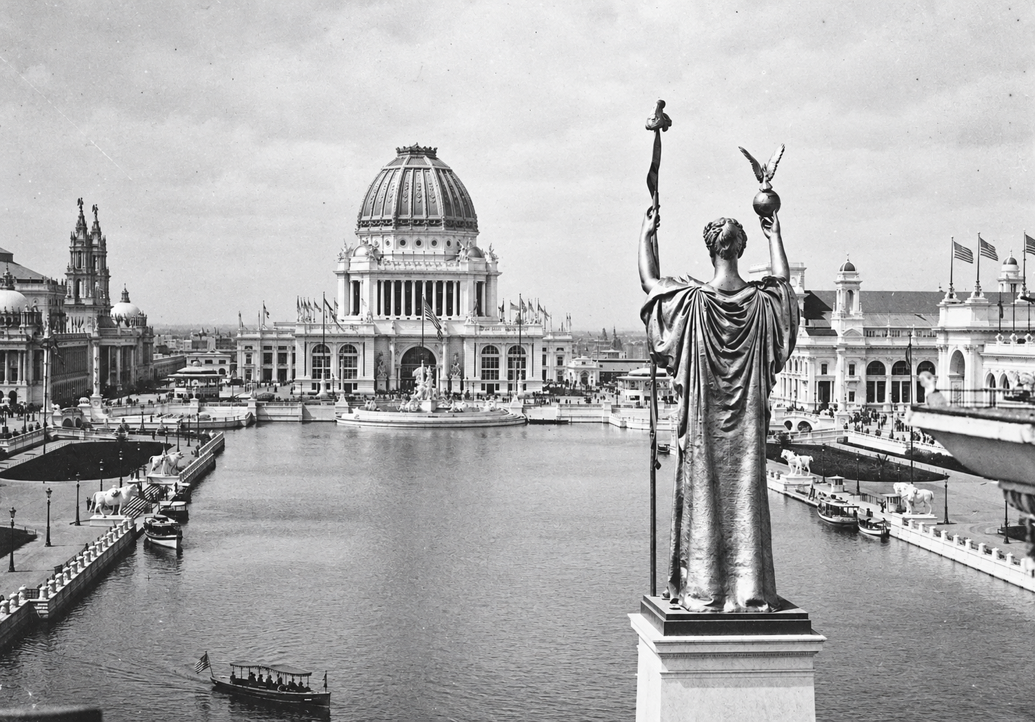 The Statue of the Republic overlooks the Grand Basin and illuminated exhibition buildings at the 1893 Chicago World’s Fair.
