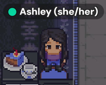 Ashley's avatar is light skinned with long dark hair in a purple top, blue pants and has cake and a tea cup to her right. 