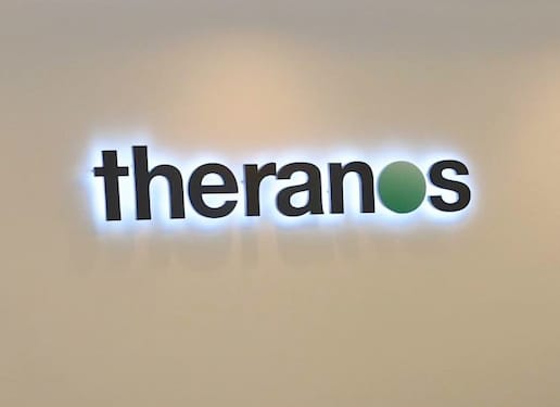 Theranos logo on wall