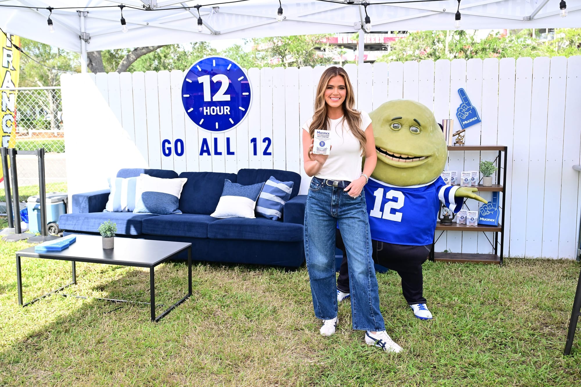 JoJo Fletcher and Mr. Mucus at Mucinex's Go All 12 Tailgate in Tampa, FL. JoJo Fletcher and Mr. Mucus at Mucinex's Go All 12 Tailgate in Tampa, FL.