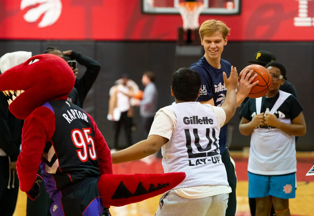 Gillette and Lay-Up team on youth basketball program