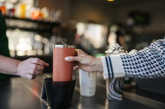 Starbucks extends reusable cup policy to drive-thru and pick-up in North America