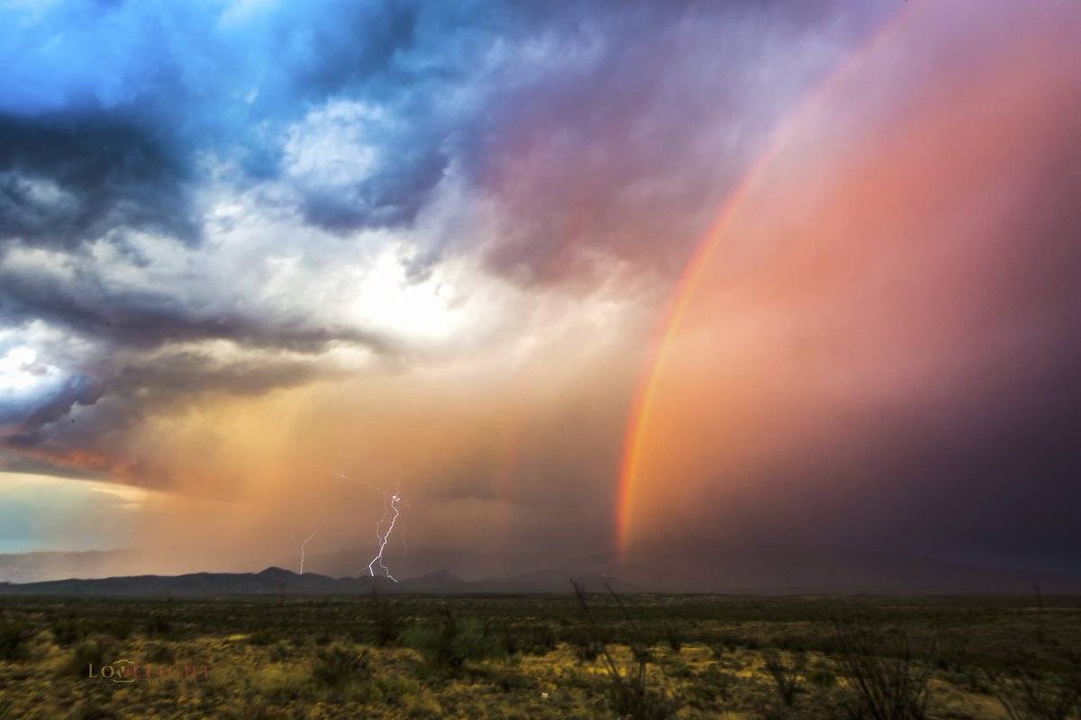 1st Place Lori Grace Bailey @lorigraceaz Epic dbl rainbow and CG lightning over the Rincon Mts E of Tucson, AZ!