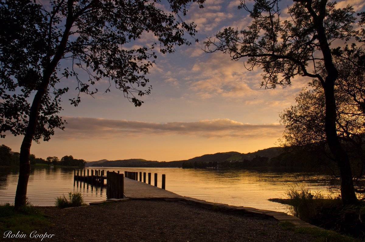 3rd Place Robin Cooper @R3Cooper Waiting for the last boat home, by the light of the setting sun. Coniston Water