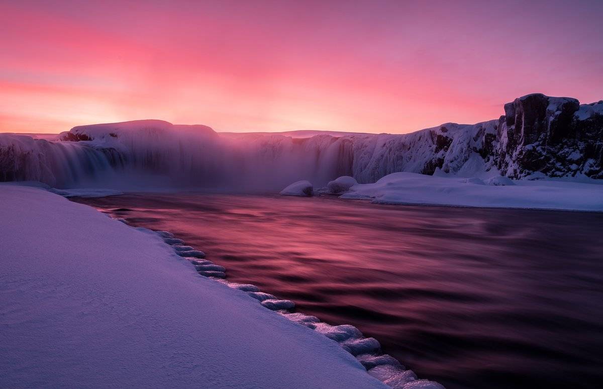 An intense, unforgettable sunset at Goðafoss â the waterfall of the gods by Serena Dzenis @serenavsworld